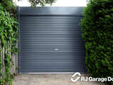 Fenceline Australian Roller Garage Door - Colorbond Colour 'Ironstone' with Square Canopy